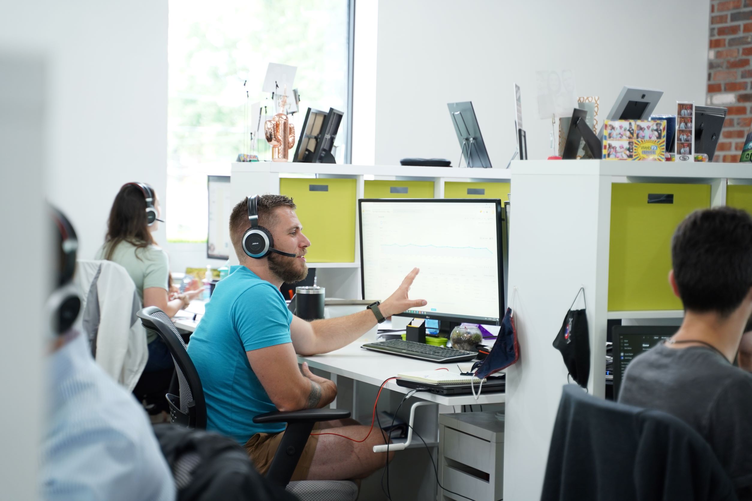 digital marketers working at computers in office